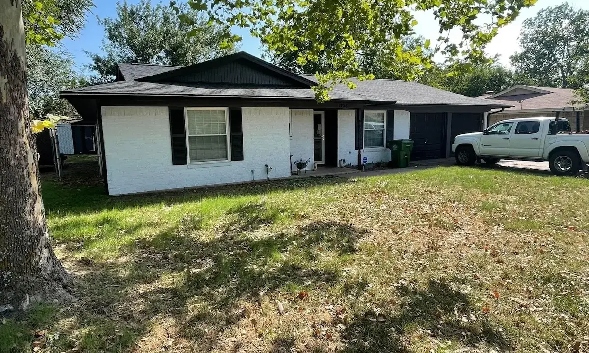 Professional roofing crew working on a residential roof in Lower Paxton